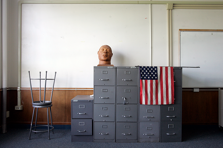 Statue of a head on filing cabinets