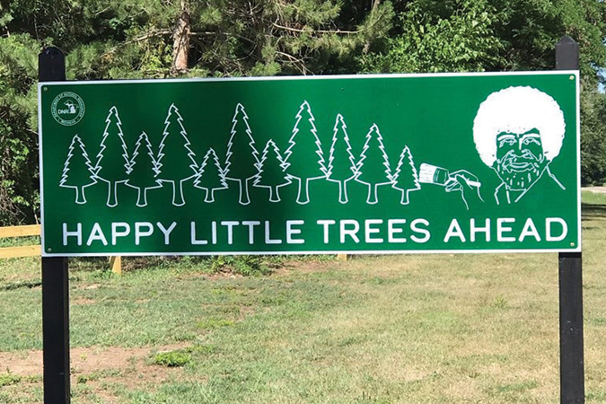 One of the Happy Little Trees signs located outside of Michigan State Parks