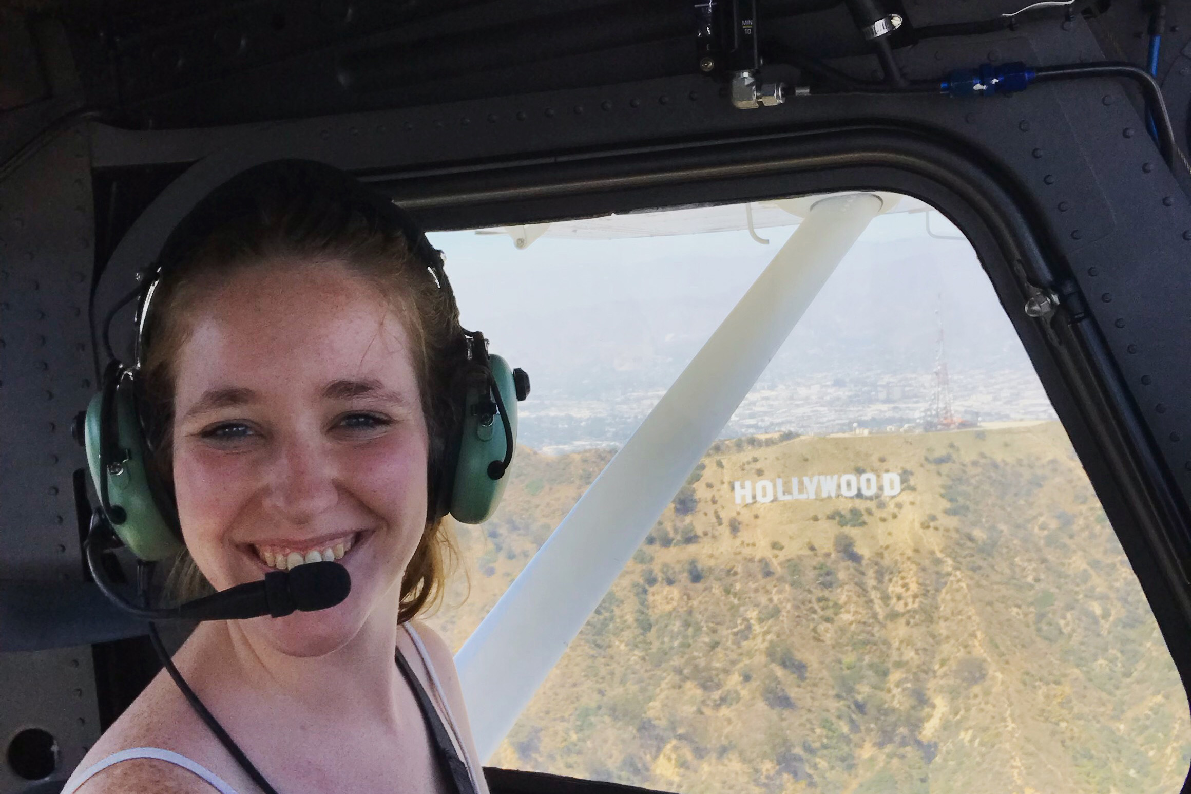 Rehm piloting a helicopter near the Hollywood sign