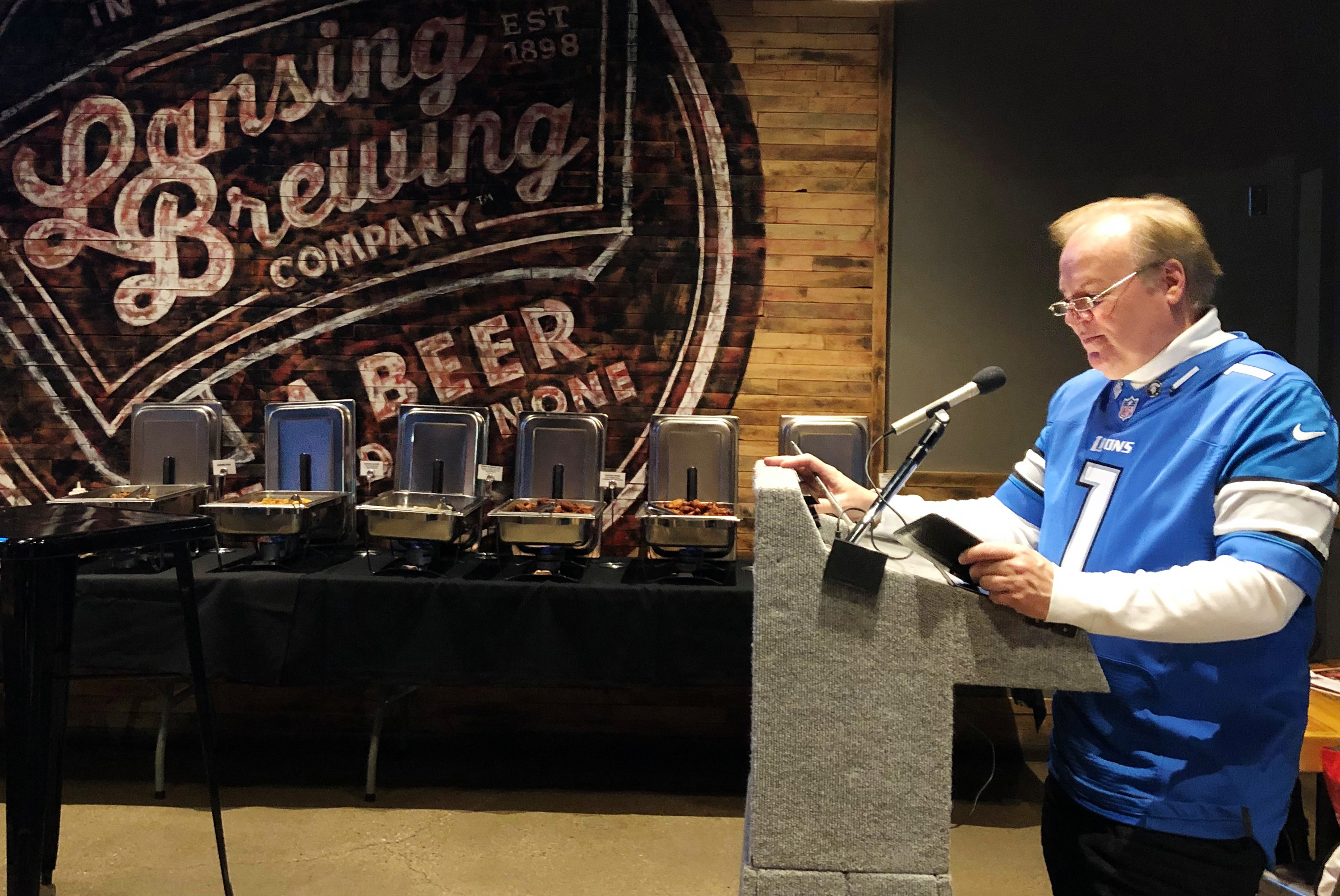 Bob Kolt speaks to professors at Lansing Brewing Company. 