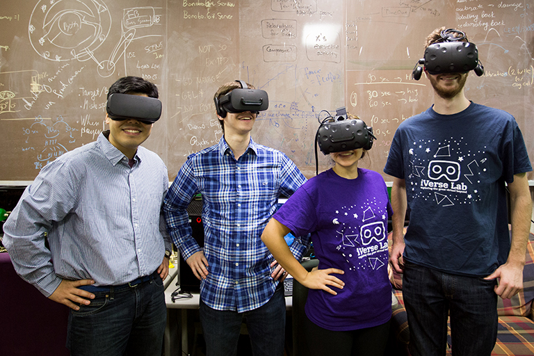 Photo of people wearing virtual reality goggles