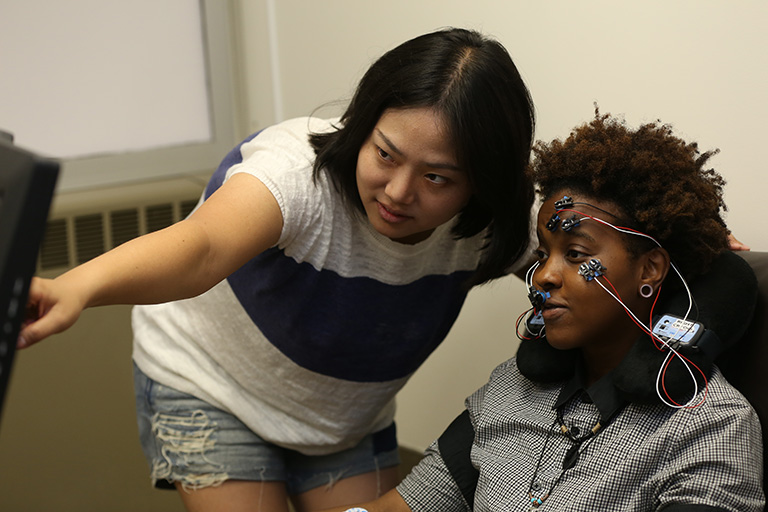 Two students working together on facial imaging project