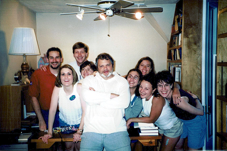 Frank Boster surrounded by eight graduate student mentees in 1998