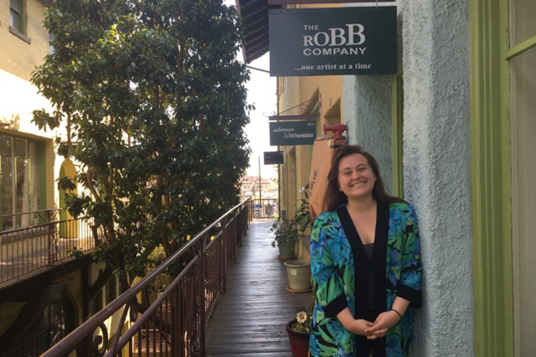 ComArtSci senior Sidney Anderson in front of the Robb Company in L.A.