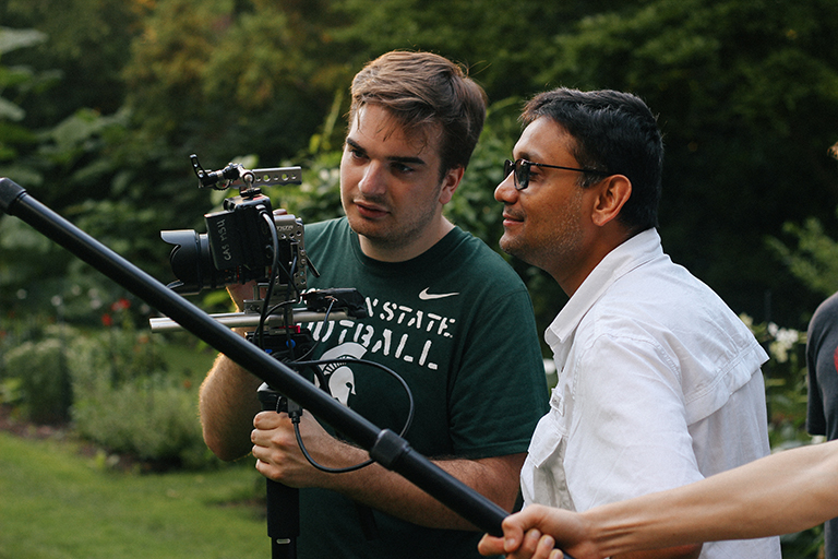 Professor Amol Pavangadkar helping a student with camera angles.