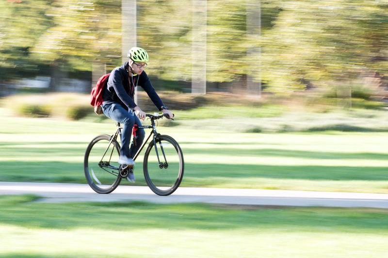 Student biking on campus