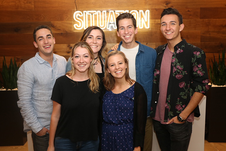 Advertising senior Kendall Buzzy (front row in blue dress) with fellow interns at Situation Interactive in NYC.