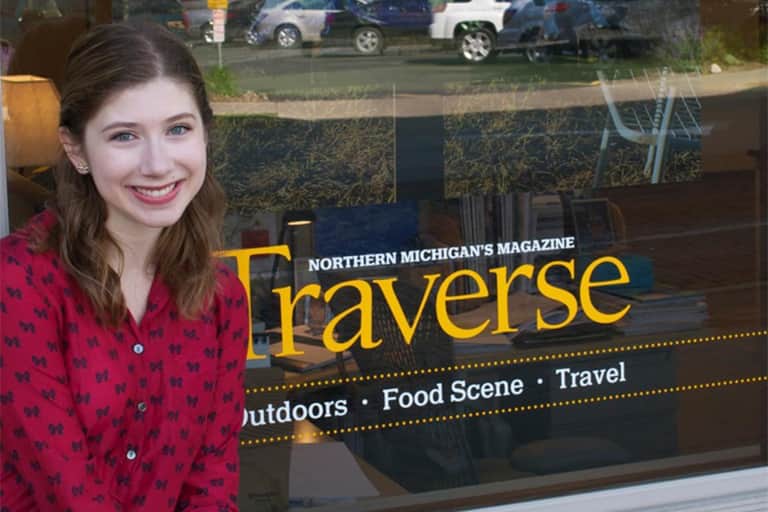 Kathryn McLravy in front of Traverse Magazine