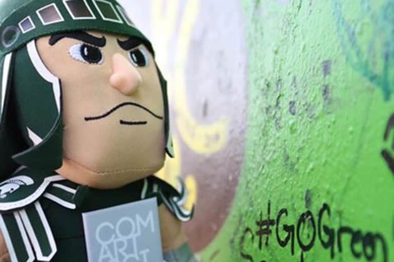 Sparty writes on the peace wall in Belfast