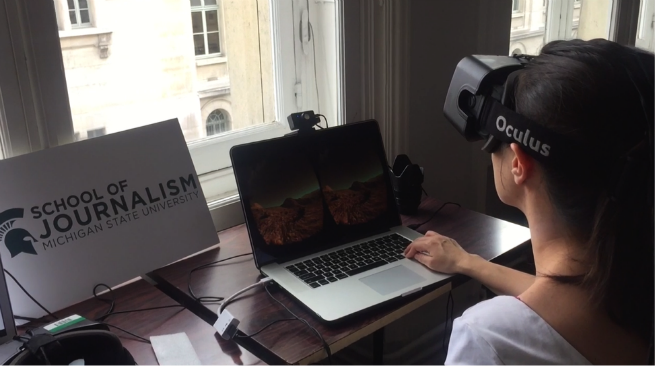 Student at computer using the Oculus rift.