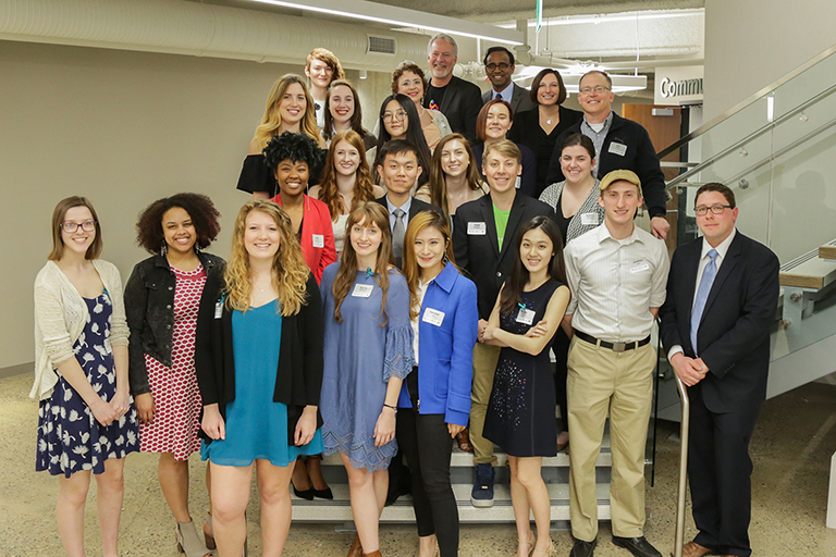 The Media Sandbox team together in a group shot after presenting their creative work to local nonprofits at MSUFCU.