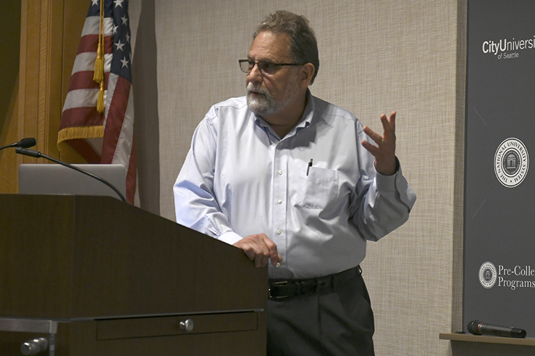 Michigan State University School of Journalism Professor Howard Bossen presents at a visual communication conference in California.