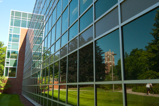 Photo of MSU campus reflected in window