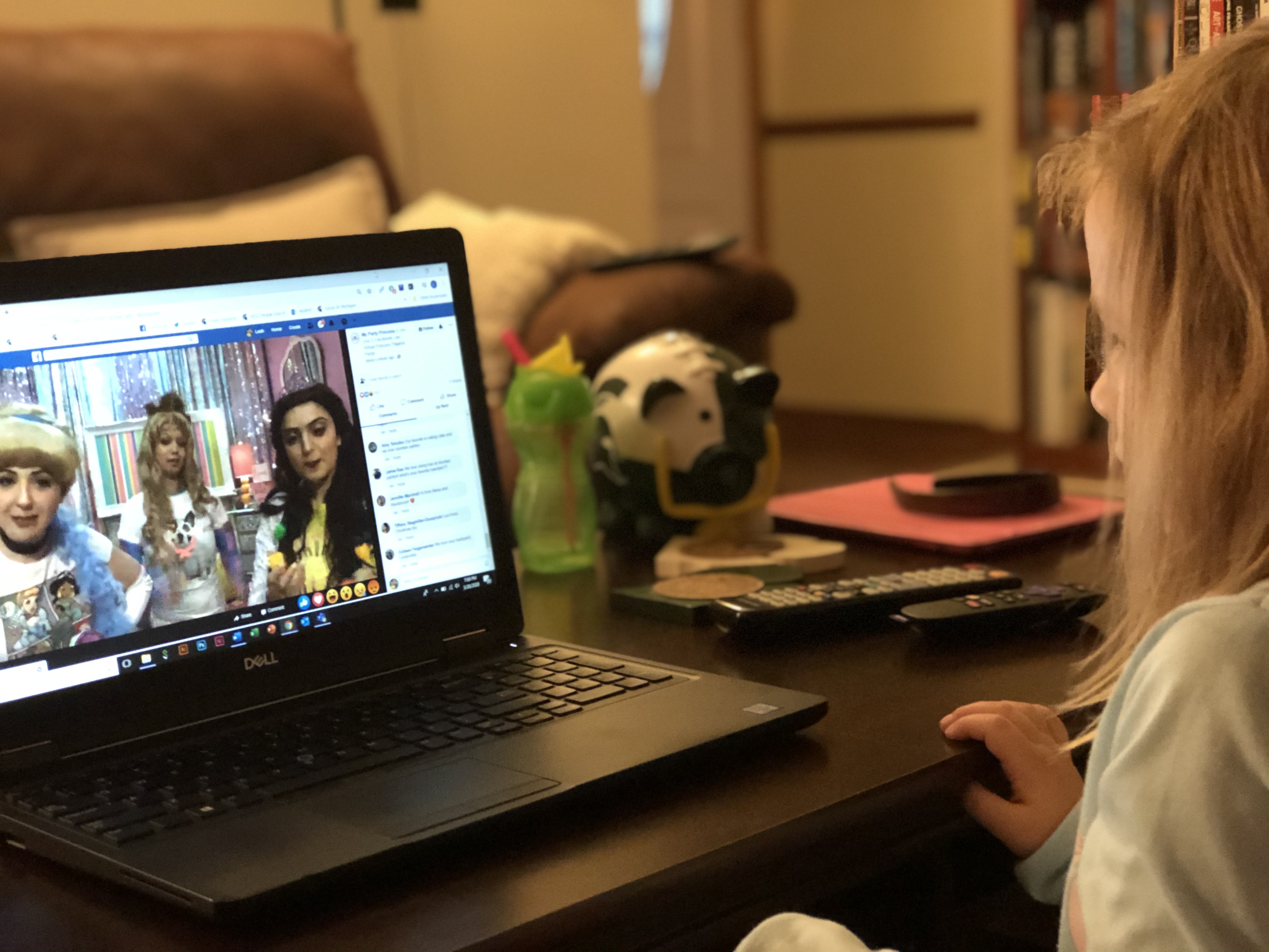 MSU StratCom student Leah Ball's daughter watching a show on a laptop