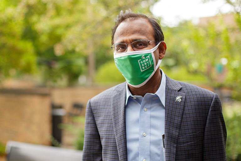Dean Prabu David in a ComArtSci mask