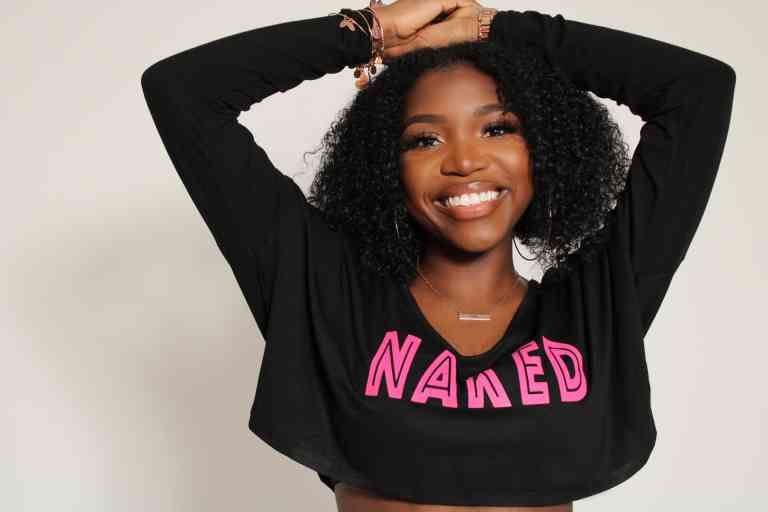 Photo of Brenda Walker with a sweatshirt for her debut film NAKED