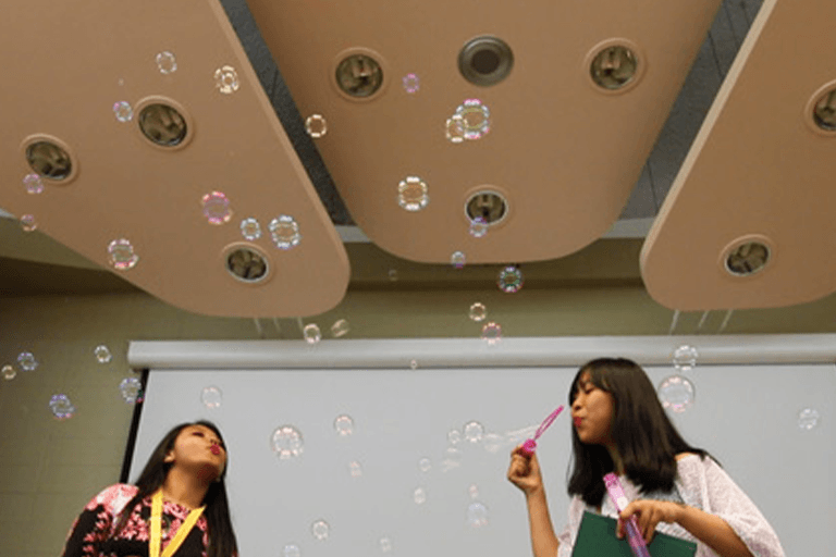 GLOBE participants blow bubbles during an event at the Erickson Hall Kiva. Photo: Leo Vosburgh, taken pre-2020