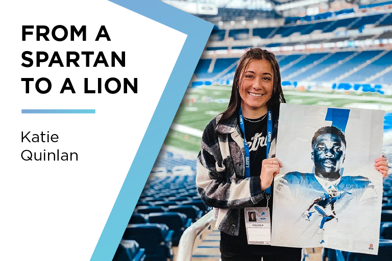 Katie Quinlan holding artwork she designed for the Detroit Lions. Text reads: From a Spartan to a Lion.