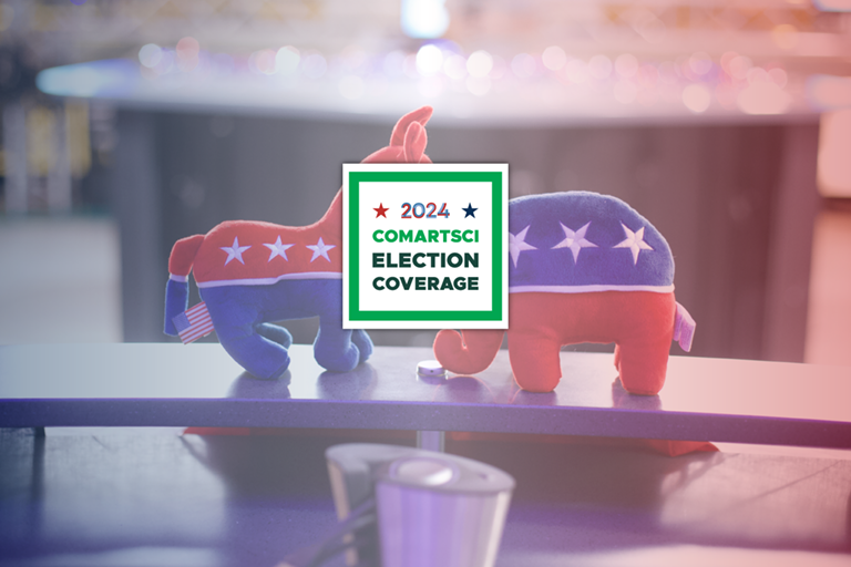 Image of the republican and democratic party animals sitting on the news desk in the Spartan Newsroom with the message overlaying the photo: "2024 ComArtSci Election Coverage" 