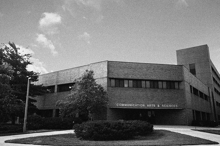 Black and white image of the College of Communication Arts and Sciences building