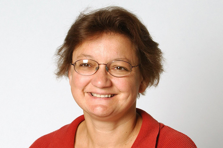 Photo Journalism alumna Susan Ager with a white background