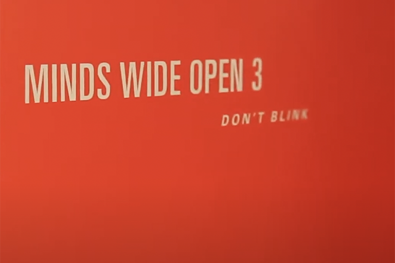 Red background with Minds Wide Open labeled on it 