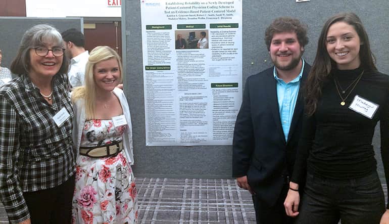 Students and professor giving presentation