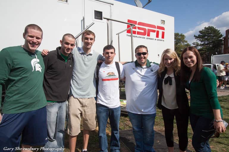 Students and professor visiting an ESPN trailer