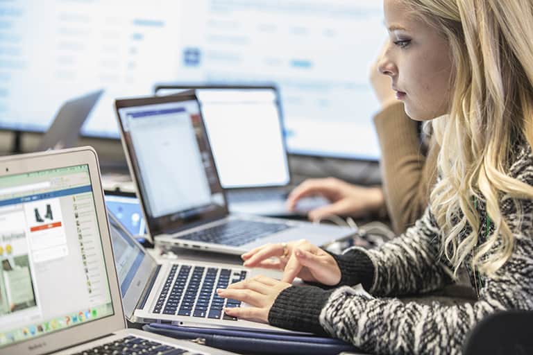 Student working on computer in lab.