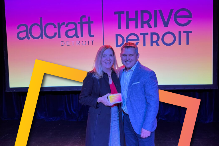 Photo of Julie Beaty holding her award