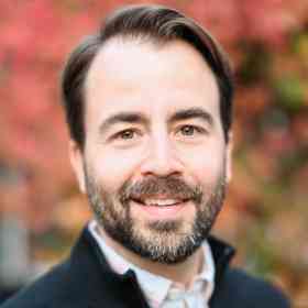 headshot of andrew poole smiling