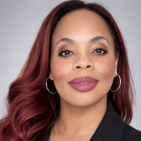 Headshot of Christina L. Myers, PhD with a grey backdrop