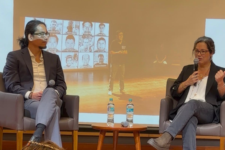 Bruno Takahashi speaking at the conference