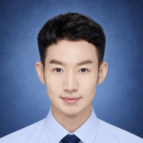 A formal portrait of a man wearing a light blue shirt and navy blue tie against a blue background.
