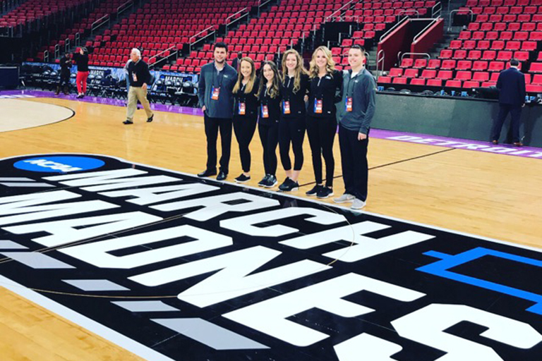 J-School students on the court during March Madness 2018.