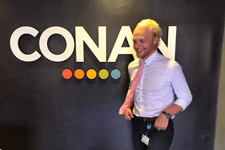 Nicholas Stahl in front of the Conan logo