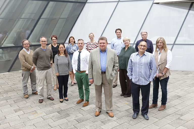 Communicative Sciences and Disorders faculty members standing together outside the Broad Art Museum on the MSU campus.