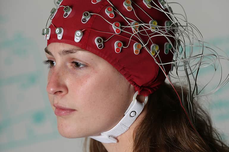 CSD graduate student participating in research on brain waves.