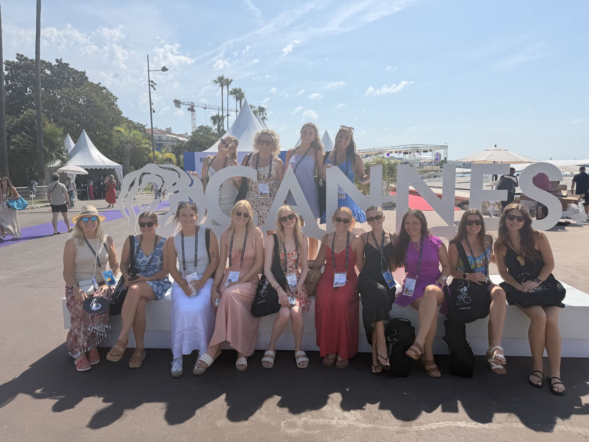 International Advertising in Cannes, France students in front of sign.