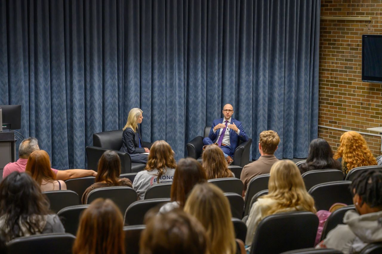 Sheri Jones sitting with New York Times' A.G. Sulzberger.