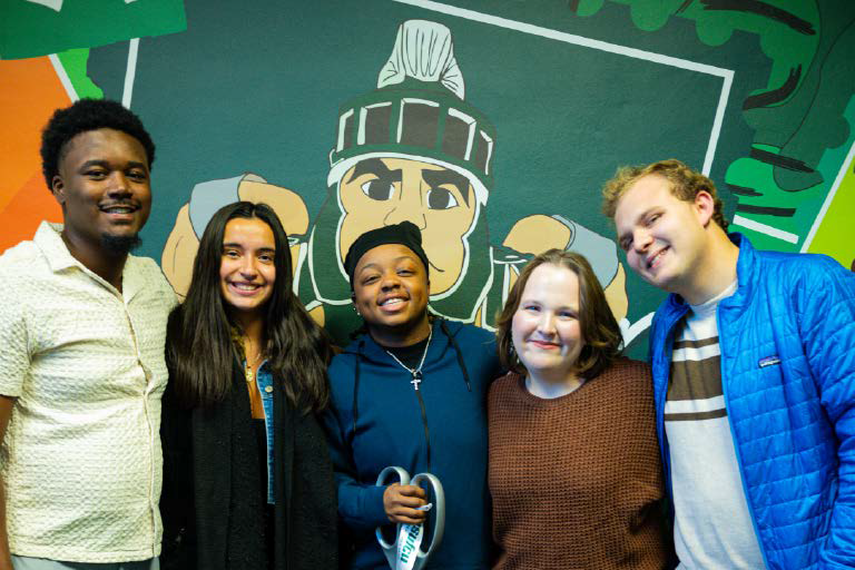 From left, Ignite the Future students, RoShawn Nabors, Haley Burton, Kato McCrimmon (mural contributor), Rebecca Finch and Ryan Thomson.