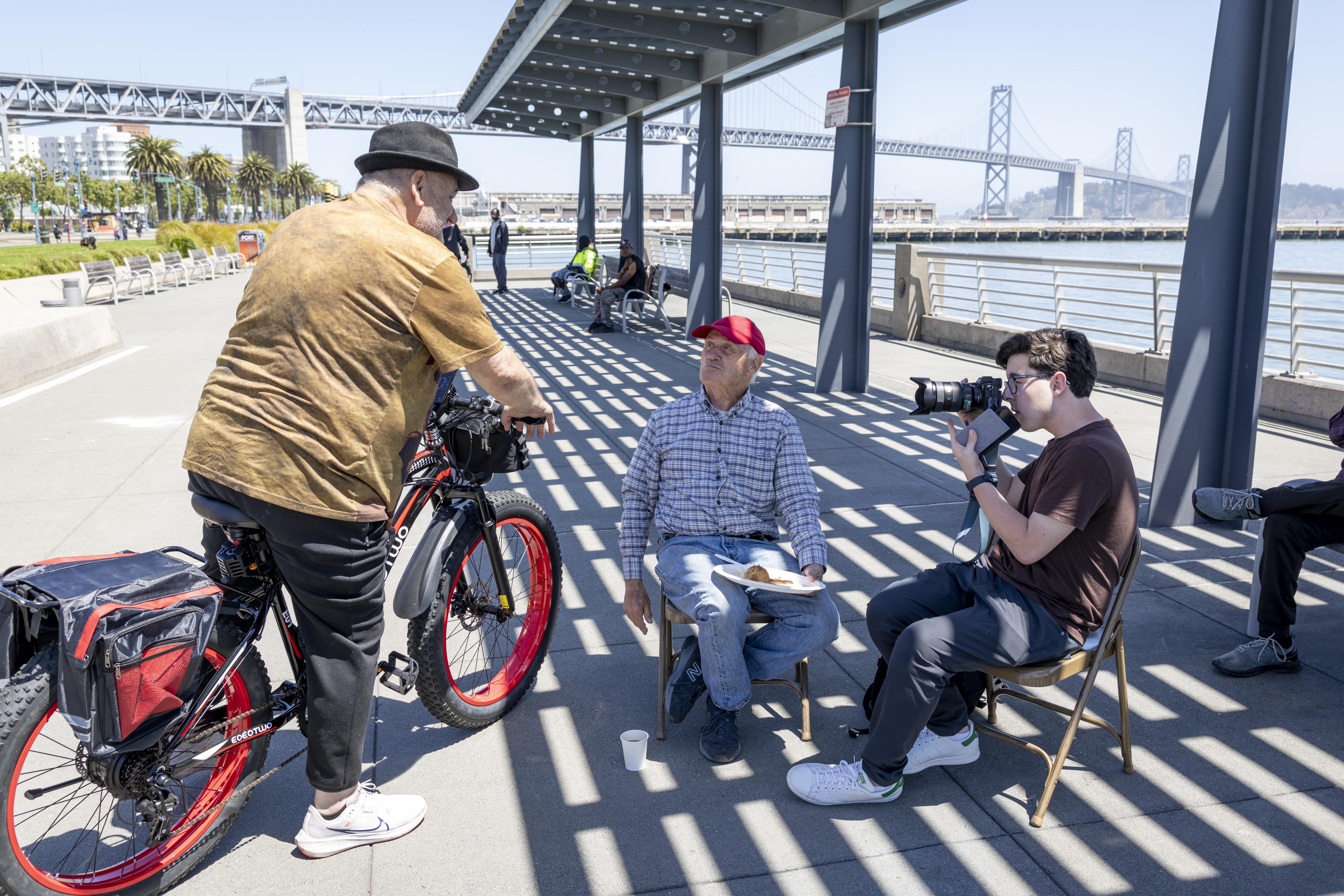 Saperstein photographing subject on bike.