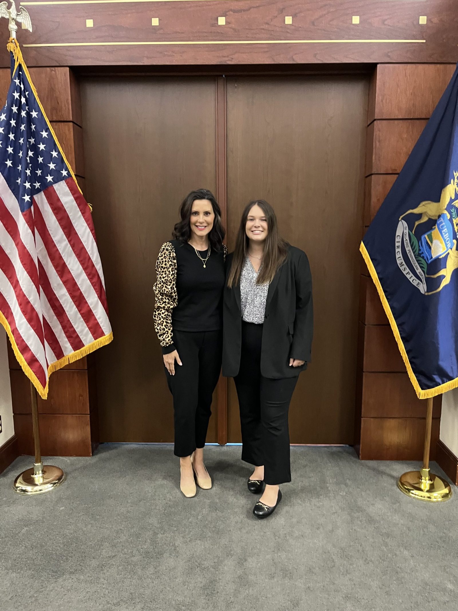 Public Relations student with Governor Whitmer getting in her internship hours.