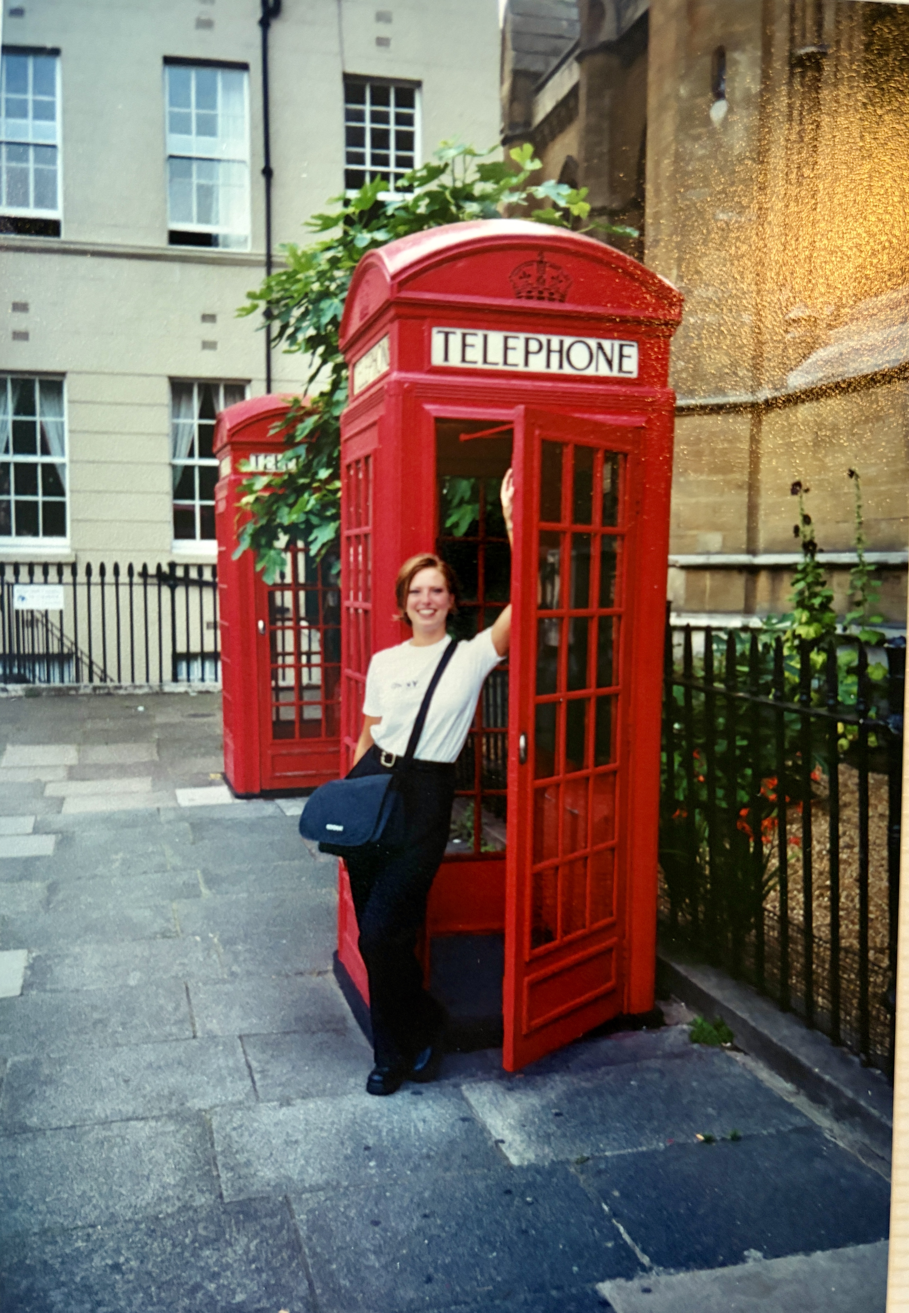 Marnie Rossow in front of a London phone booth.