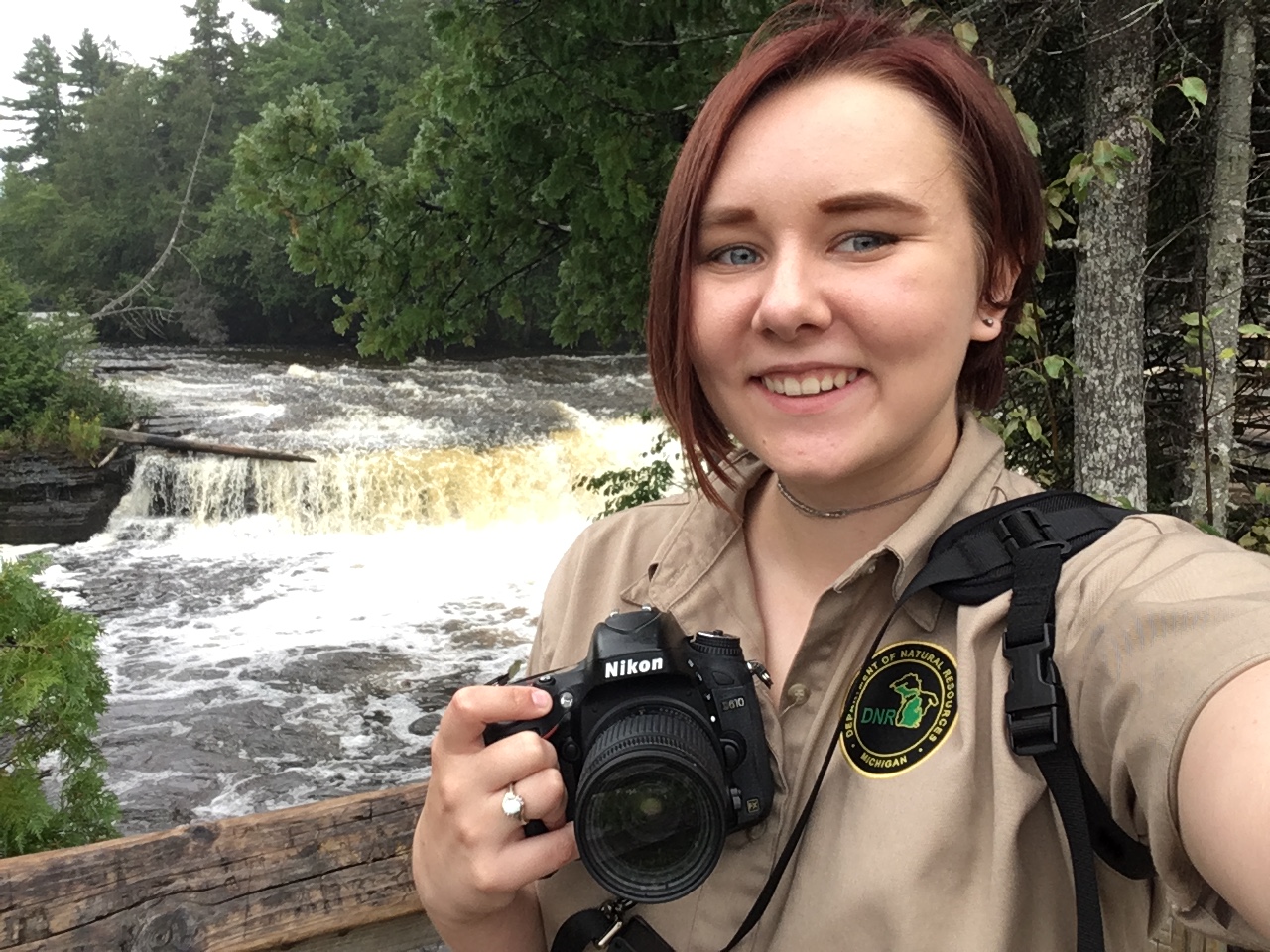 "Lyla Luoto in front of a river at MI state park"