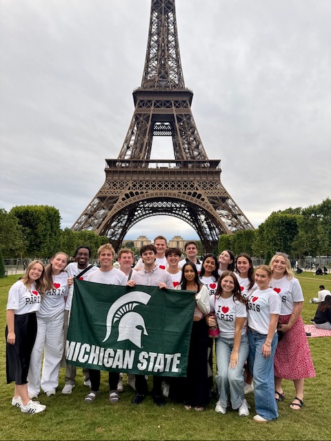 Sports Media in Paris and Rome students in front of Eiffel Tower.