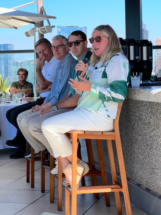 From left to right: MSU President Kevin Guskiewicz, Broad College of Business Dean David Souder, Athletic Director J Batt, and College of Communication Arts and Sciences Dean Heidi Hennink-Kaminski Dean Heidi holding a microphone speaking