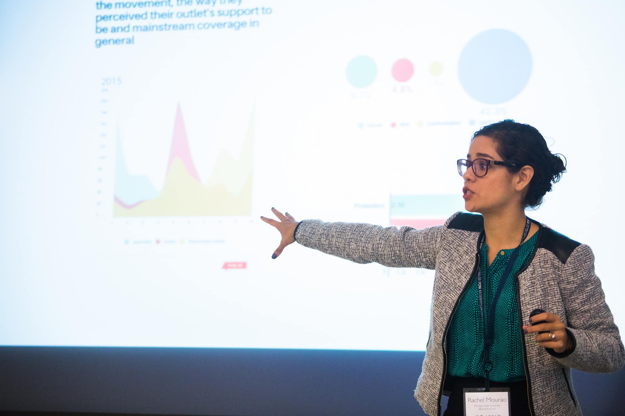 "Mourão presents on her research at a recent conference"